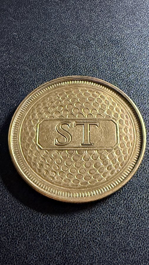 Engraved brass golf coin with initials